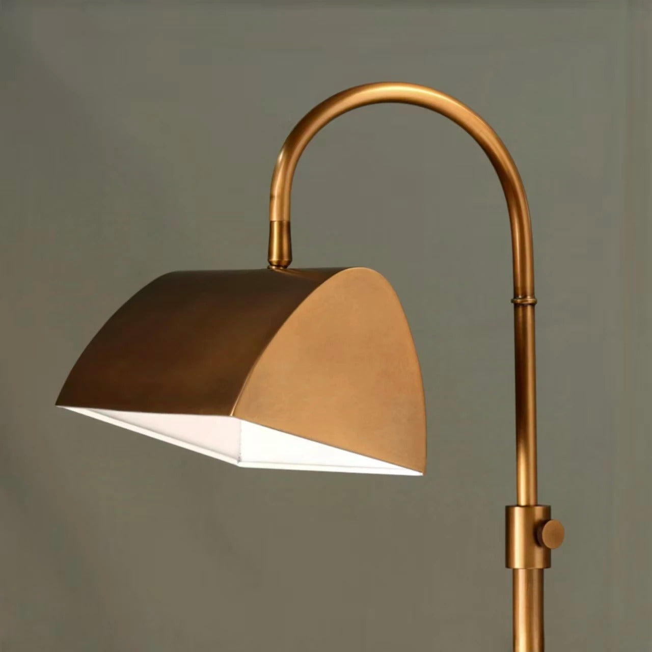 Table lamp with curved arm